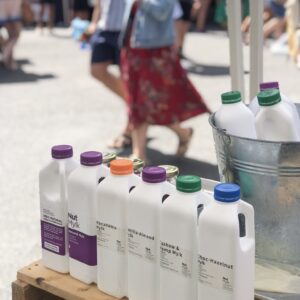 Image of different type of freshly made NutMylk at Farmers Market